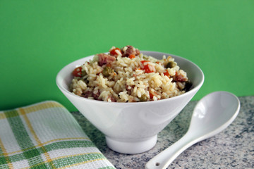 Chinese food, bowl with rice, peas, carrots and pork