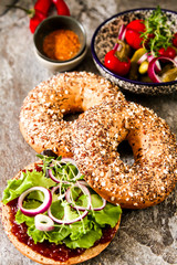 vegan bagel made at home with lettuce and sauce