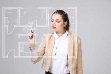 Female architect working with a virtual apartment plan