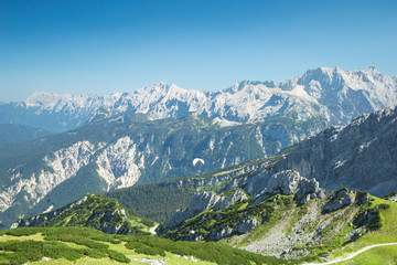 Alps mountains aerial view with paraglider over Alpine landscape