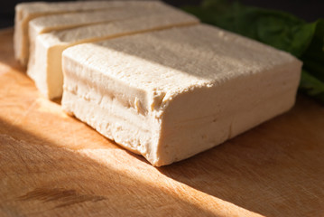 Slices of raw tofu and spinach