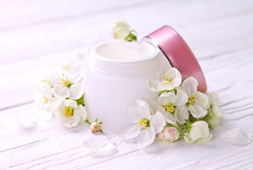 Fototapeta na wymiar Natural facial cream with apple blossom