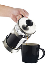 pouring coffee on a black mug