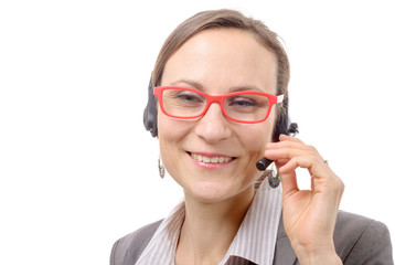 Close-up portrait of smiling young woman with headset