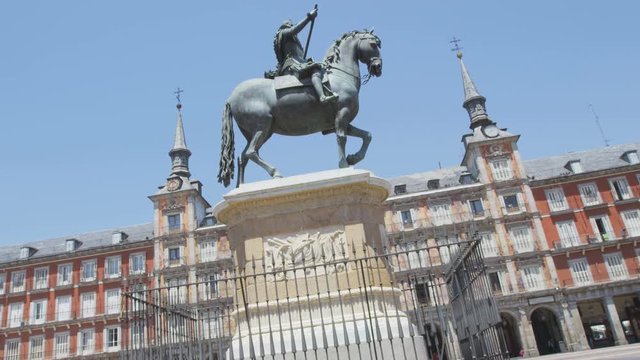 Madrid - Plaza Mayor. Landmark tourist attraction: Statue of Felipe III. Famous tourist destination in Spain, Europe. Shot on RED EPIC.