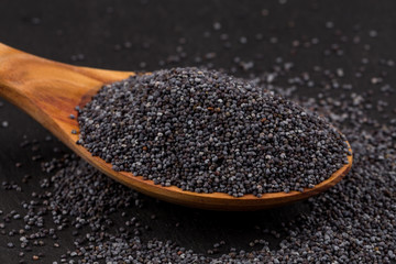 Wooden spoon with poppy seeds