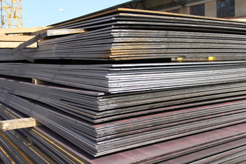 Steel plate. Metal sheet. Hot-rolled flat steel. Metal leaf. Rusty ferrum. Heavy steel plates.
