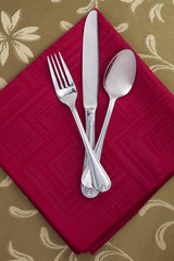 red of table napkin and utensils