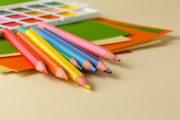 school supplies on plain beige background