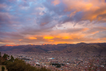 Cityscape of Cusco and cloudscape at dusk, Peru