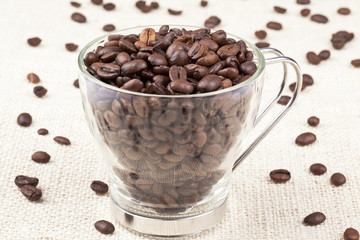 coffee beans in coffee mug.