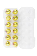 easter eggs wrapped in yellow foil paper.