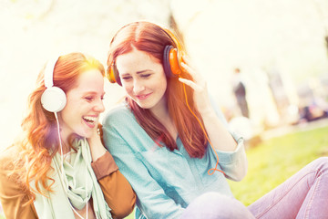 two girls hearing sounds