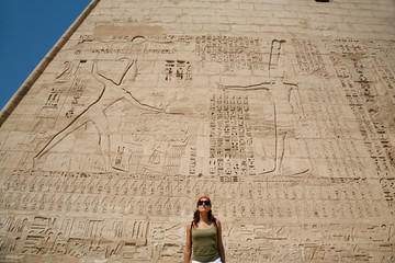 woman in facade of Medinet Habu Temple