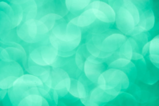 De-focused blur light green emerald big haze bubbles - abstract