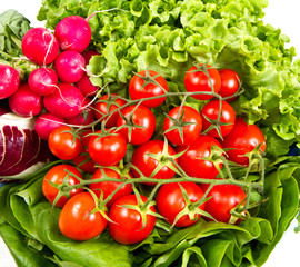 ripe cherry tomatoes and salad  on a white background