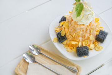 Tea with Milk (shaved ice) corn flakes topping Bing Su Korean dessert or Taiwan Dessert called 
