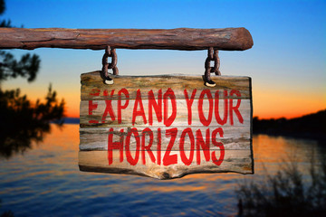 Fototapeta premium Expand your horizons motivational phrase sign