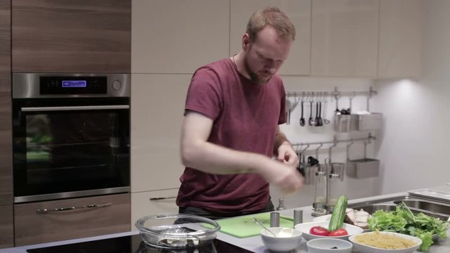 Man prepares fish steaks