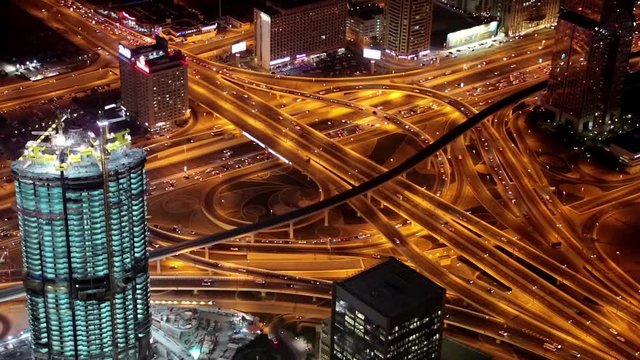 Dubai traffic at night, United Arab Emirates. View on Sheikh Zayed road from the 124th floor of Burj Khalifa skyscraper in Dubai, currently the tallest structure in the world, 829,8 m or 2,722 ft