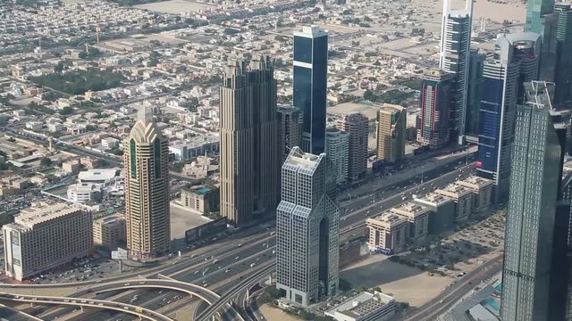 Dubai downtown, United Arab Emirates. View on Sheikh Zayed road from the 124th floor of Burj Khalifa skyscraper in Dubai, currently the tallest structure in the world, 829 m. At the top - Burj Khalifa