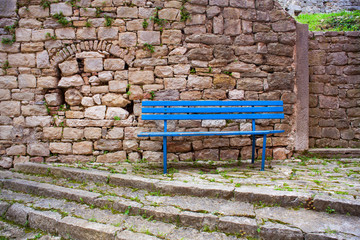 View of blue bench