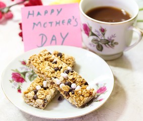 Mother's Day background with granola bars coffee and Happay Mother's day note