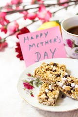 Mother's Day background with granola bars coffee and Happay Mother's day note