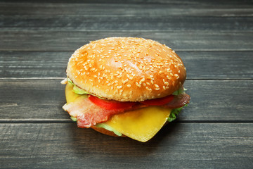 Bacon and cheese burger at rustic wood