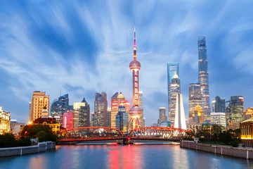 Tuinposter Beautiful modern city at night in Shanghai, China © ABCDstock