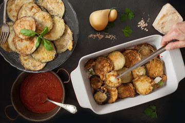 Adding Fried Eggplant Slices To Parmigiana