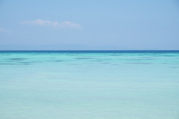 Fototapeta na wymiar Ocean view of beautiful summer calm sea in blue sky.