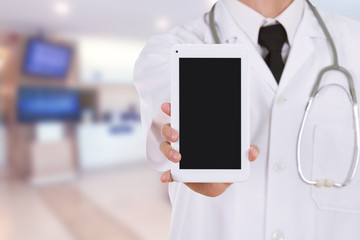 doctor showing tablet computer blank screen in hospital