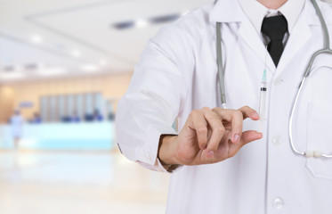 doctor holding syringe in hospital