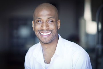 Portrait Of A Mature Black Man Smiling At Home © annawin