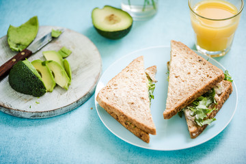 Fototapeta na wymiar Chicken and avocado wholegrain bread sandwich