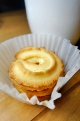 Butter cookies on a wood background.