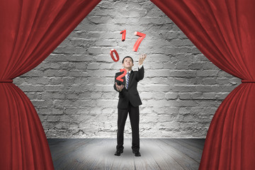 Businessman catching throwing 2017 red words