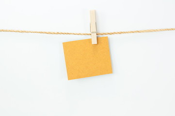 Notice card, brown paper and wood clips