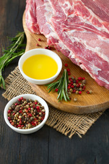 raw pork neck meat on wooden table