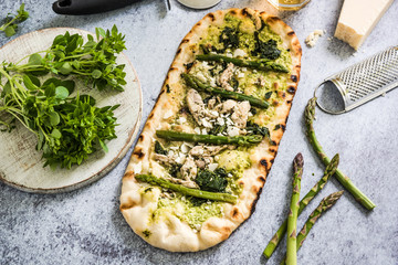 Pizza with fresh spring vegetables and herbs
