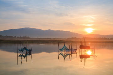 The fish trap in lake In the dawn light.