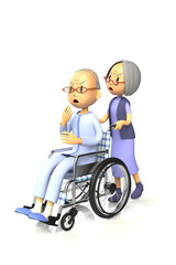 妻に車いすを押してもらう老人