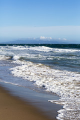 Pacific ocean is clear day. Beach landscape in the USA with the blue sea, Santa Monica. 