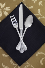 utensils on black napkin