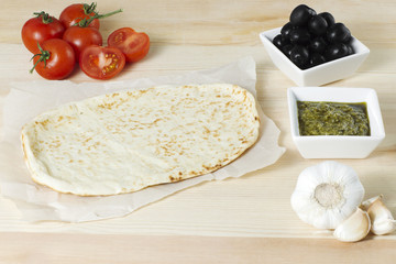 preparing pizza ingredients on the table