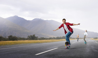 Fototapeta na wymiar Young people riding skateboard