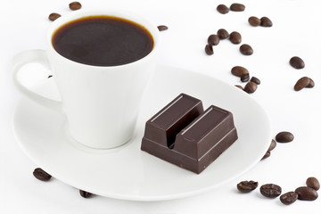 coffee and chocolate bar in saucer.
