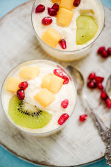 Mousse with pomegranate seeds and fruits
