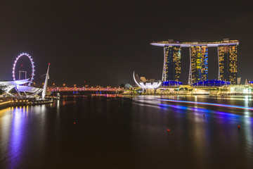 Fototapeta na wymiar Marina Bay Sands Singapore and Singapore flyer at night time